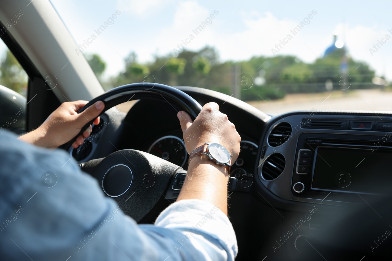 Man driving car with steering wheel, closeup Photo of Man driving car with steering wheel, closeup