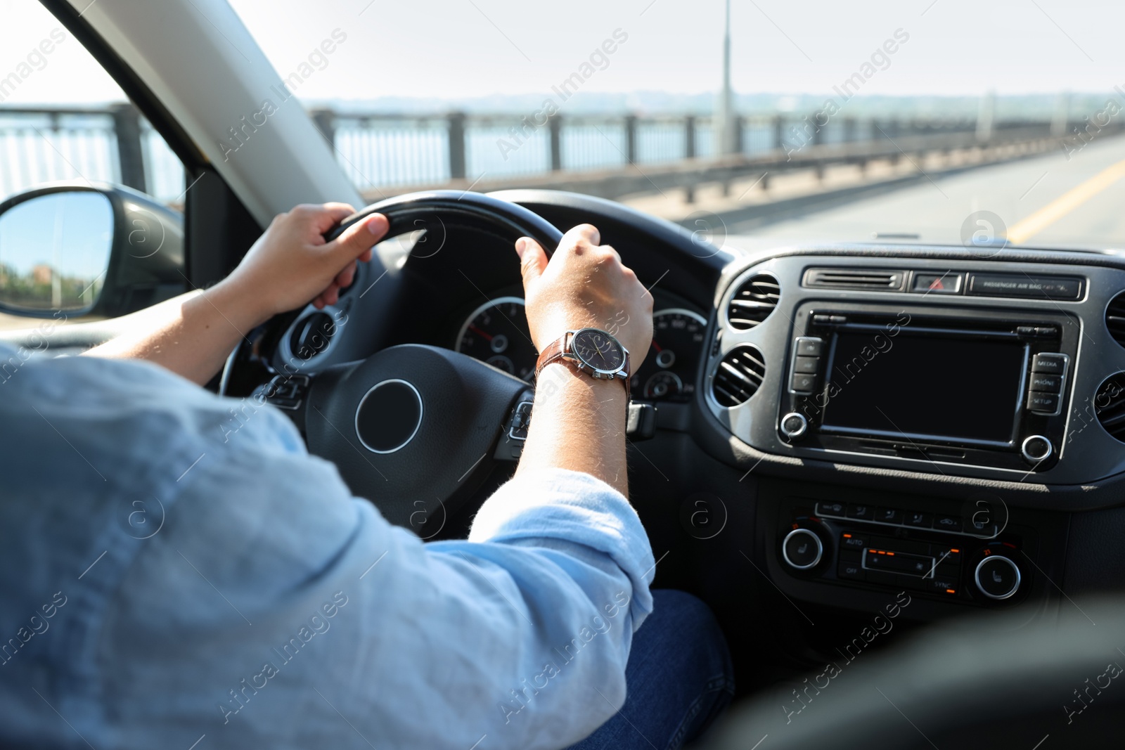 Man driving car with steering wheel, closeup Photo of Man driving car with steering wheel, closeup