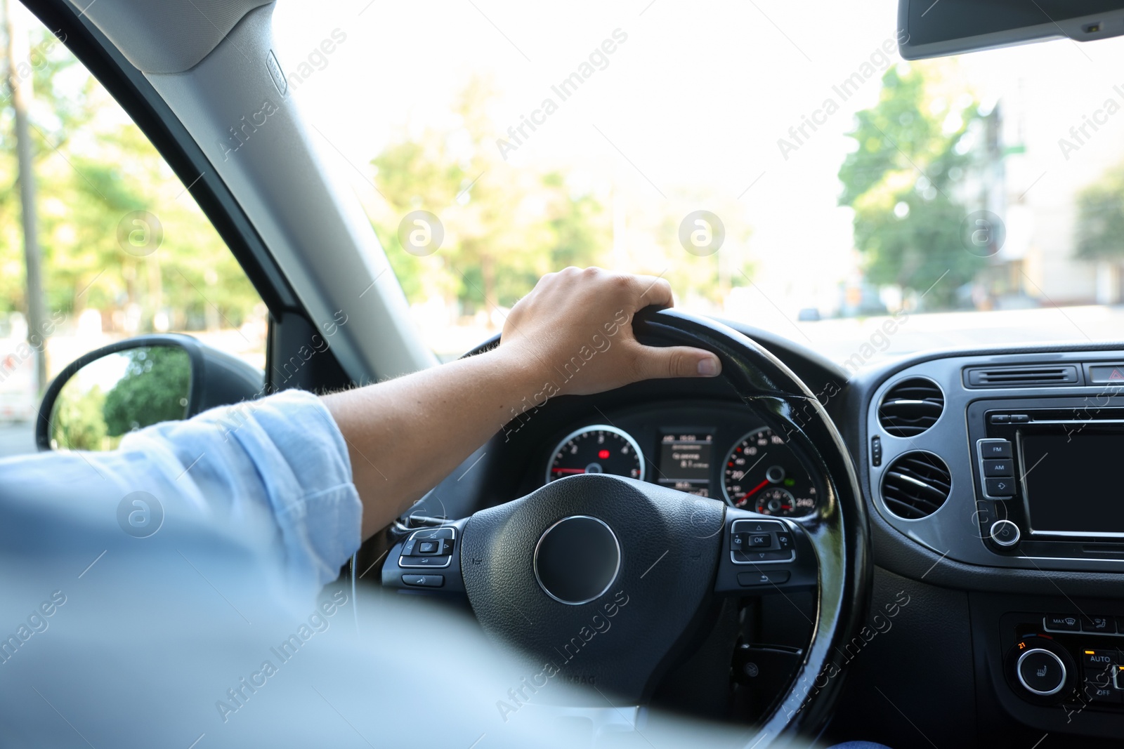 Man driving car with steering wheel, closeup Photo of Man driving car with steering wheel, closeup