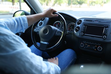 Photo of Man driving car with steering wheel, closeup