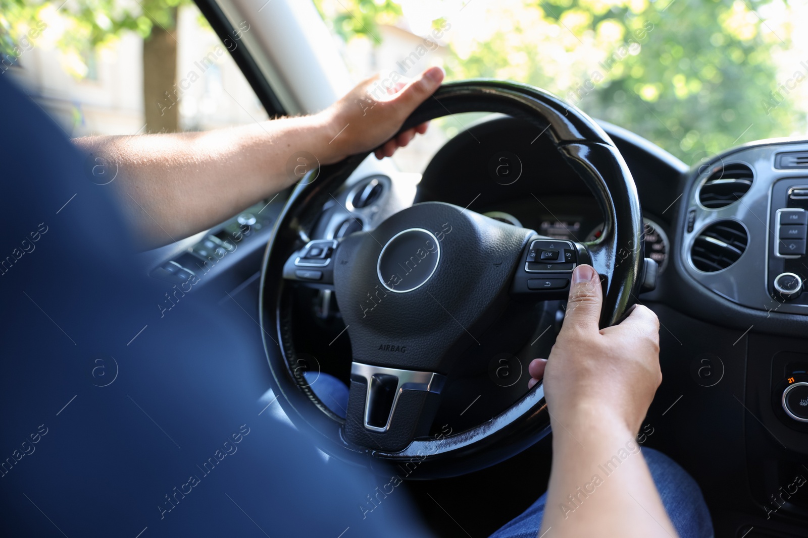 Man driving car with steering wheel, closeup Photo of Man driving car with steering wheel, closeup