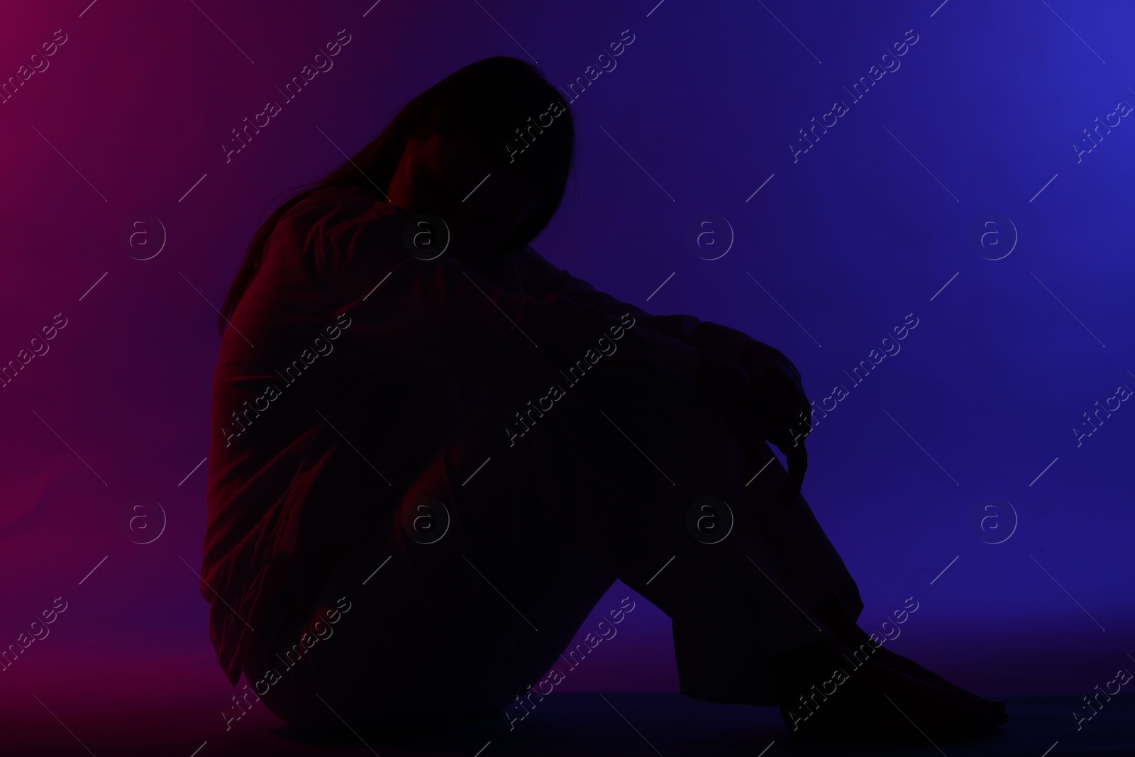 Silhouette of woman on bright color background Photo of Silhouette of woman on bright color background