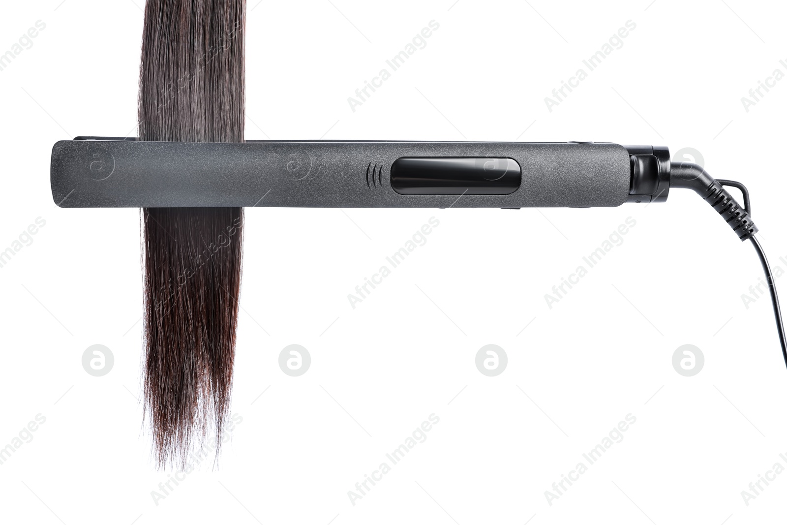Straightener with brown hair lock isolated on white Photo of Straightener with brown hair lock isolated on white