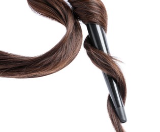 Photo of Curling iron with brown hair lock isolated on white