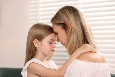 Photo of Mother and her daughter after apology at home