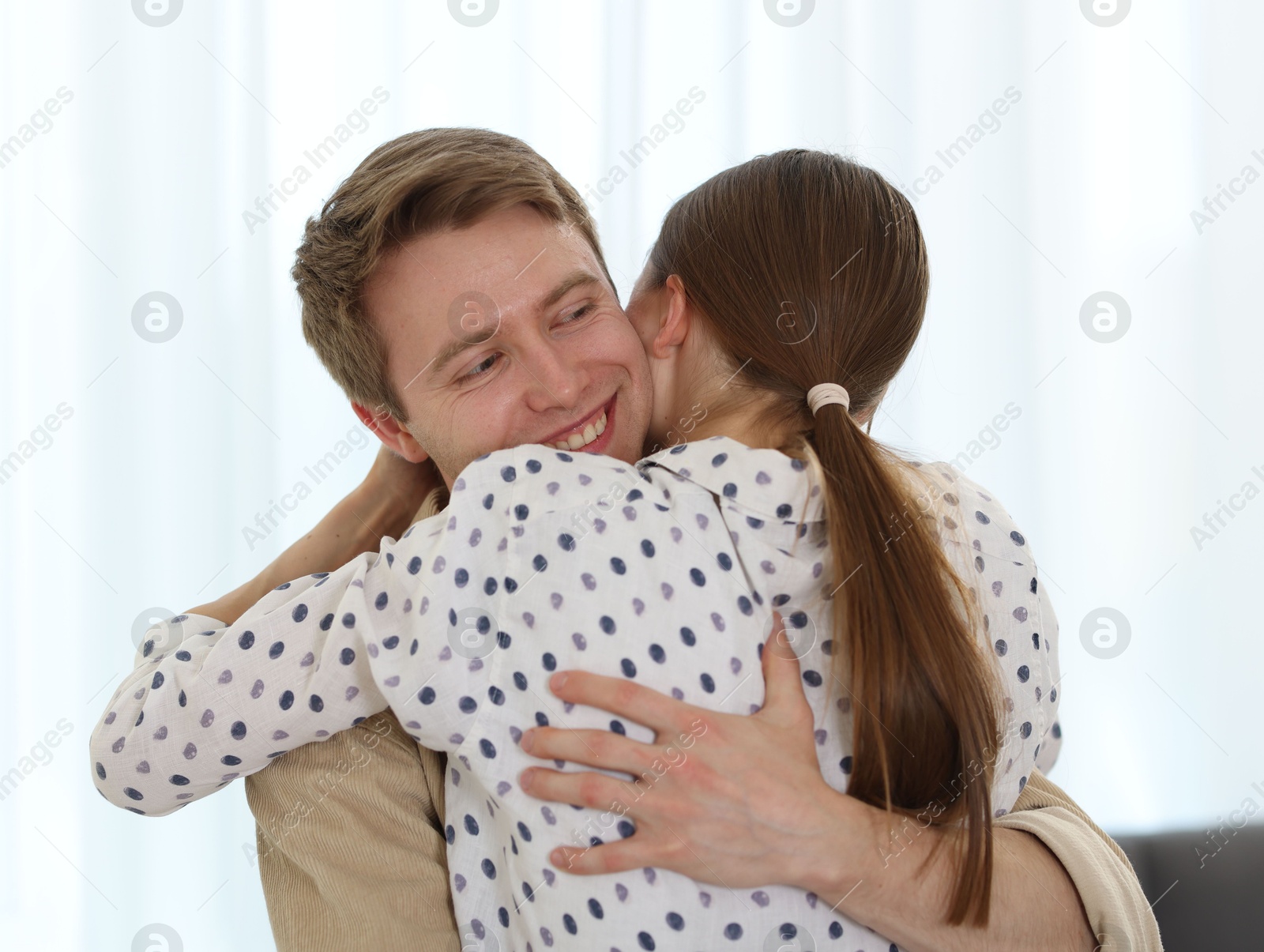 Happy couple hugging after apology at home Photo of Happy couple hugging after apology at home