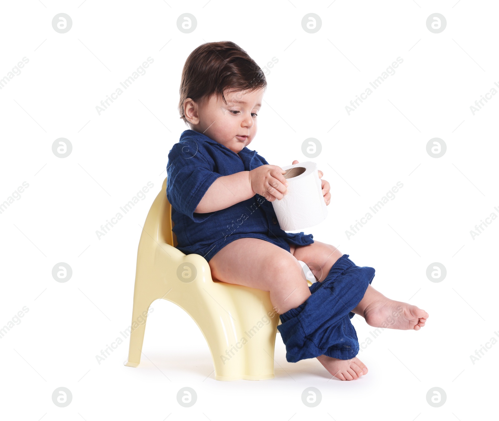Photo of Cute little baby sitting on potty with toilet paper against white background