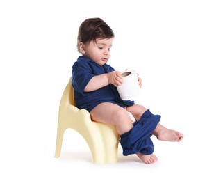 Photo of Cute little baby sitting on potty with toilet paper against white background