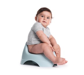 Photo of Cute little baby sitting on potty against white background