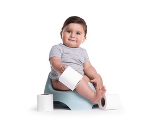 Photo of Cute little baby sitting on potty with toilet paper against white background