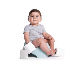 Photo of Cute little baby sitting on potty with toilet paper against white background