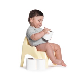 Photo of Cute little baby sitting on potty with toilet paper against white background