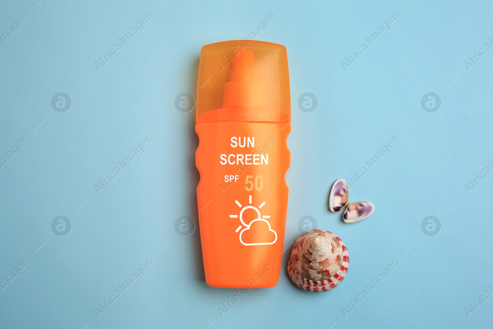 Sunscreen in bottle and seashells on pastel blue background, top view. Sun protection product Image of Sunscreen in bottle and seashells on pastel blue background, top view. Sun protection product