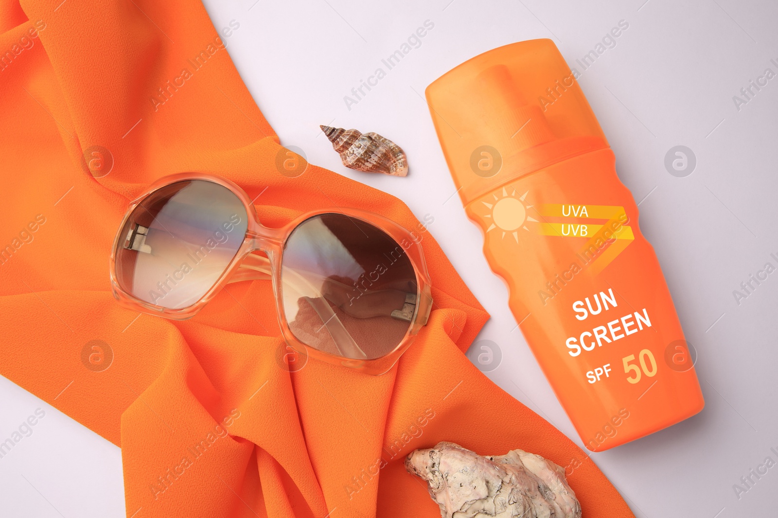 Sunscreen in bottle, sunglasses and cloth on white background, top view. Sun protection product Image of Sunscreen in bottle, sunglasses and cloth on white background, top view. Sun protection product