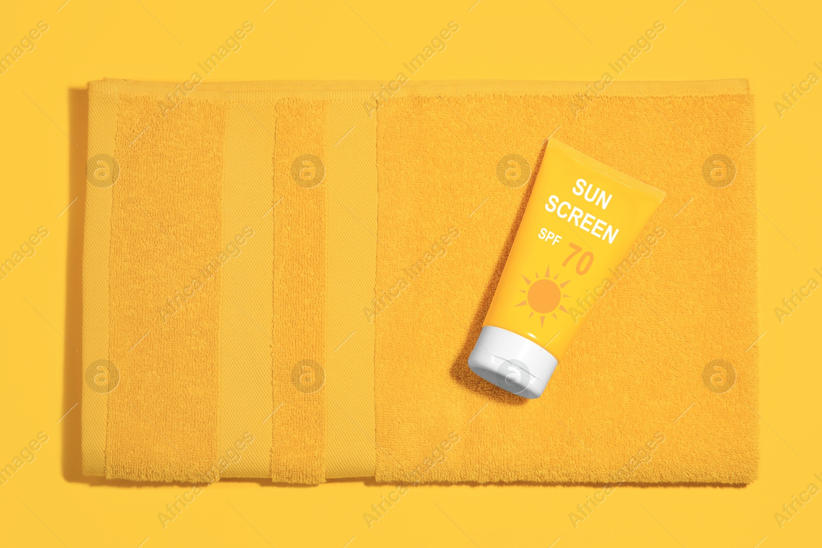 Sunscreen in tube and beach towel on orange, top view. Sun protection product Image of Sunscreen in tube and beach towel on orange, top view. Sun protection product