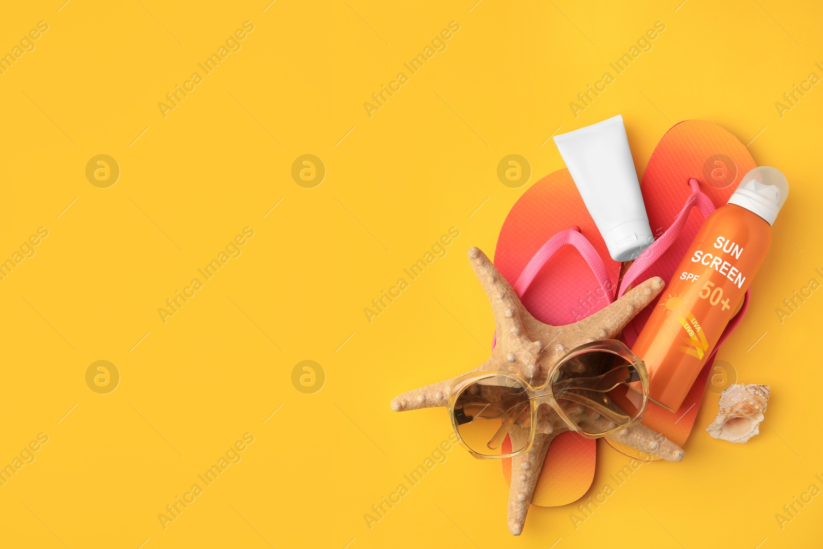 Sunscreens, flip flops and sunglasses on orange background, top view. Sun protection product Image of Sunscreens, flip flops and sunglasses on orange background, top view. Sun protection product
