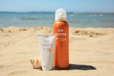 Image of Sunscreens in tube and bottle on beach. Sun protection product