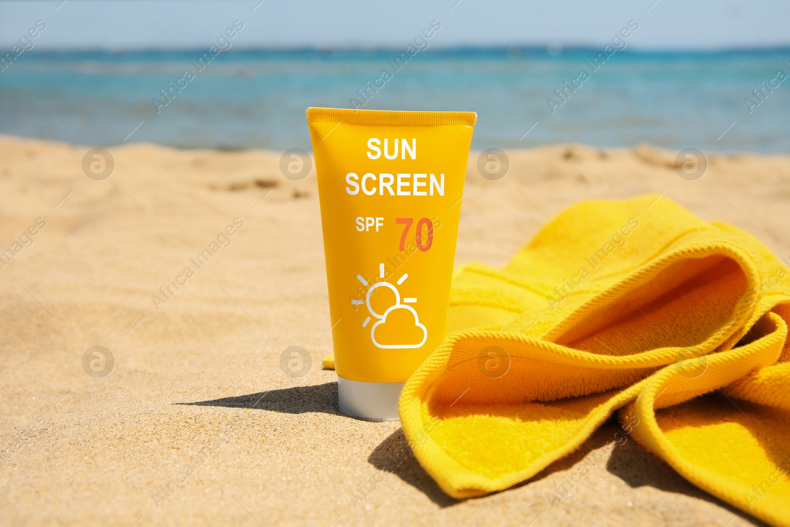 Sunscreen in tube and towel on beach. Sun protection product Image of Sunscreen in tube and towel on beach. Sun protection product