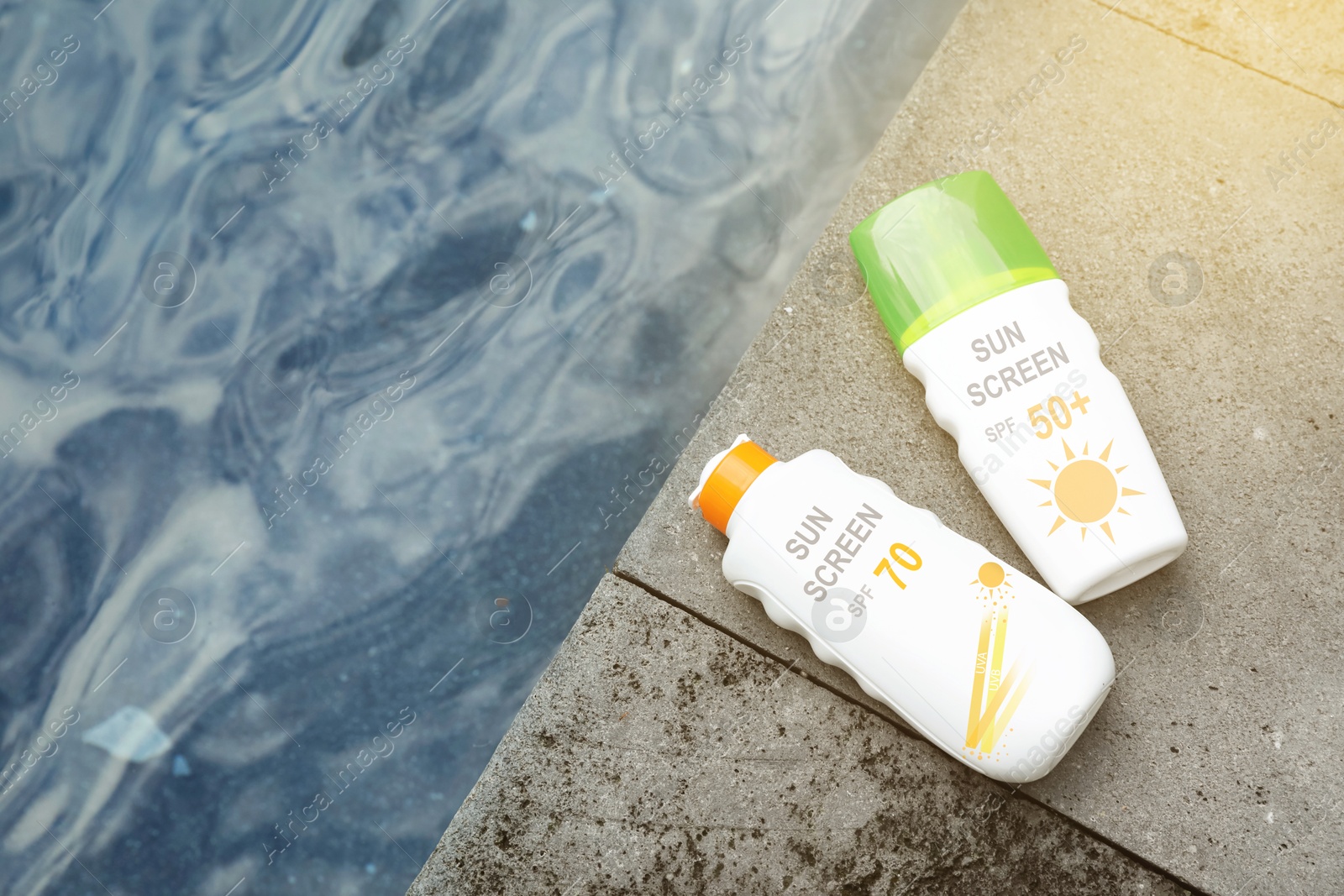 Sunscreens in bottles on stone surface near sea, top view. Sun protection product Image of Sunscreens in bottles on stone surface near sea, top view. Sun protection product