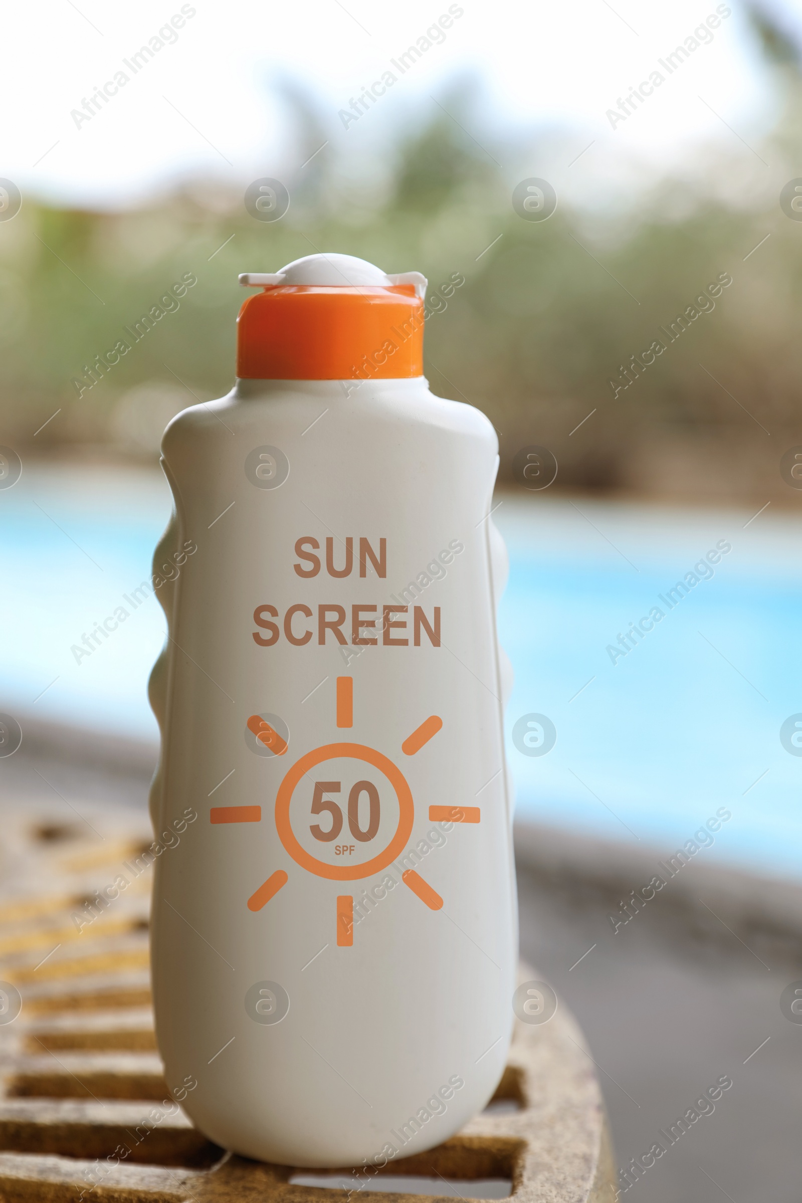 Sunscreen in bottle near swimming pool. Sun protection product Image of Sunscreen in bottle near swimming pool. Sun protection product