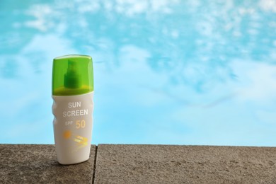 Image of Sunscreen in bottle on swimming pool edge. Sun protection product