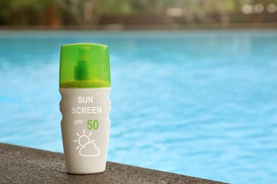 Image of Sunscreen in bottle on swimming pool edge. Sun protection product