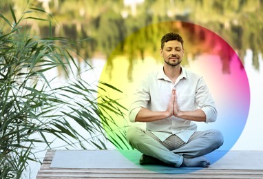 Image of Man meditating in Lotus pose on pier near river. Rainbow bubble around him representing aura