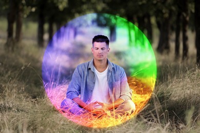 Image of Man meditating in Lotus pose in nature. Rainbow bubble around him representing aura