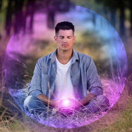 Image of Man meditating in Lotus pose in nature. Bright bubble around him representing aura
