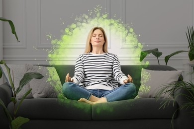 Image of Woman meditating in Lotus pose at home. Bubble around her representing aura