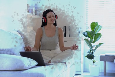 Image of Woman meditating in Lotus pose at home. Bubble around her representing aura
