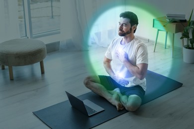 Image of Man meditating in Lotus pose at home. Rainbow bubble around him representing aura