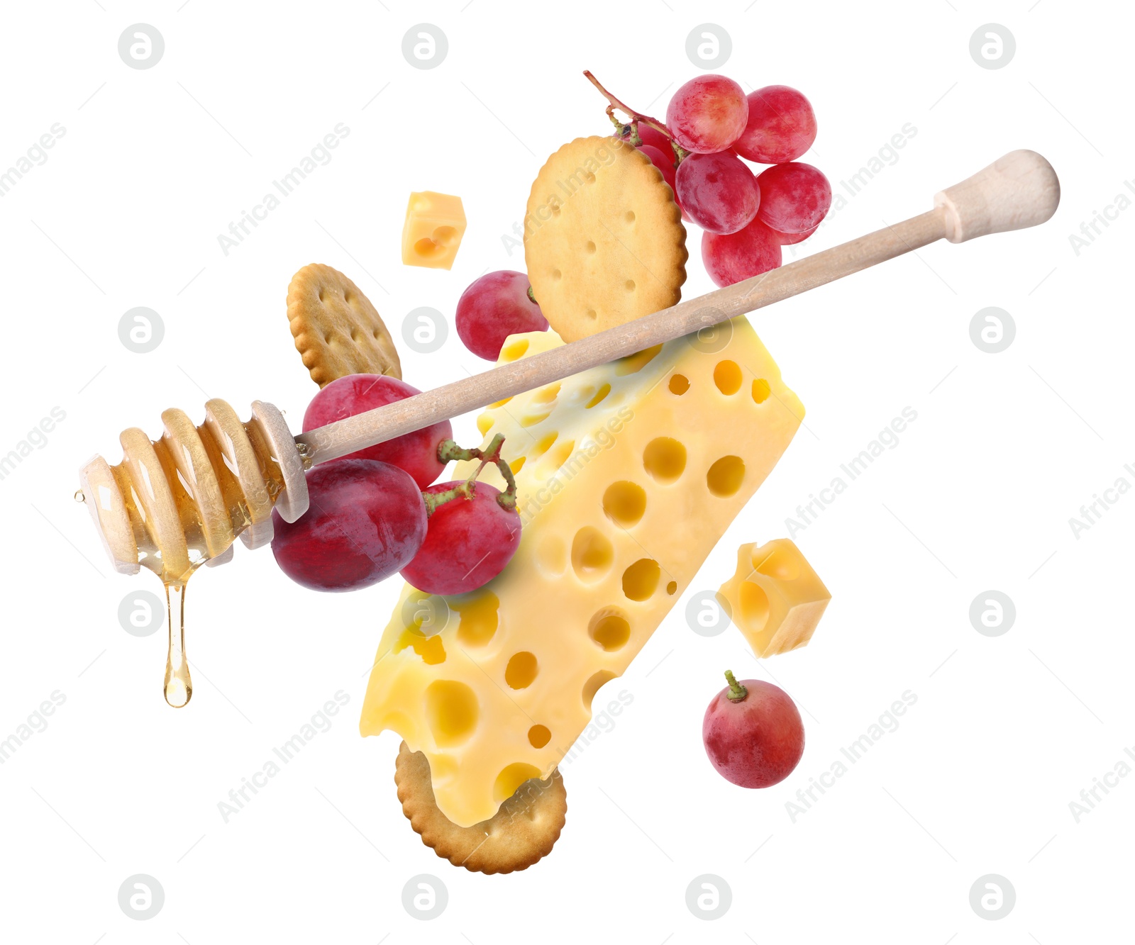 Cheese, grapes, crackers and honey in air on white background. Tasty appetizers for cheese board Image of Cheese, grapes, crackers and honey in air on white background. Tasty appetizers for cheese board