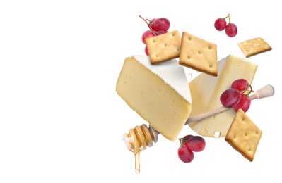 Image of Cheese, grapes, crackers and honey in air on white background. Tasty appetizers for cheese board
