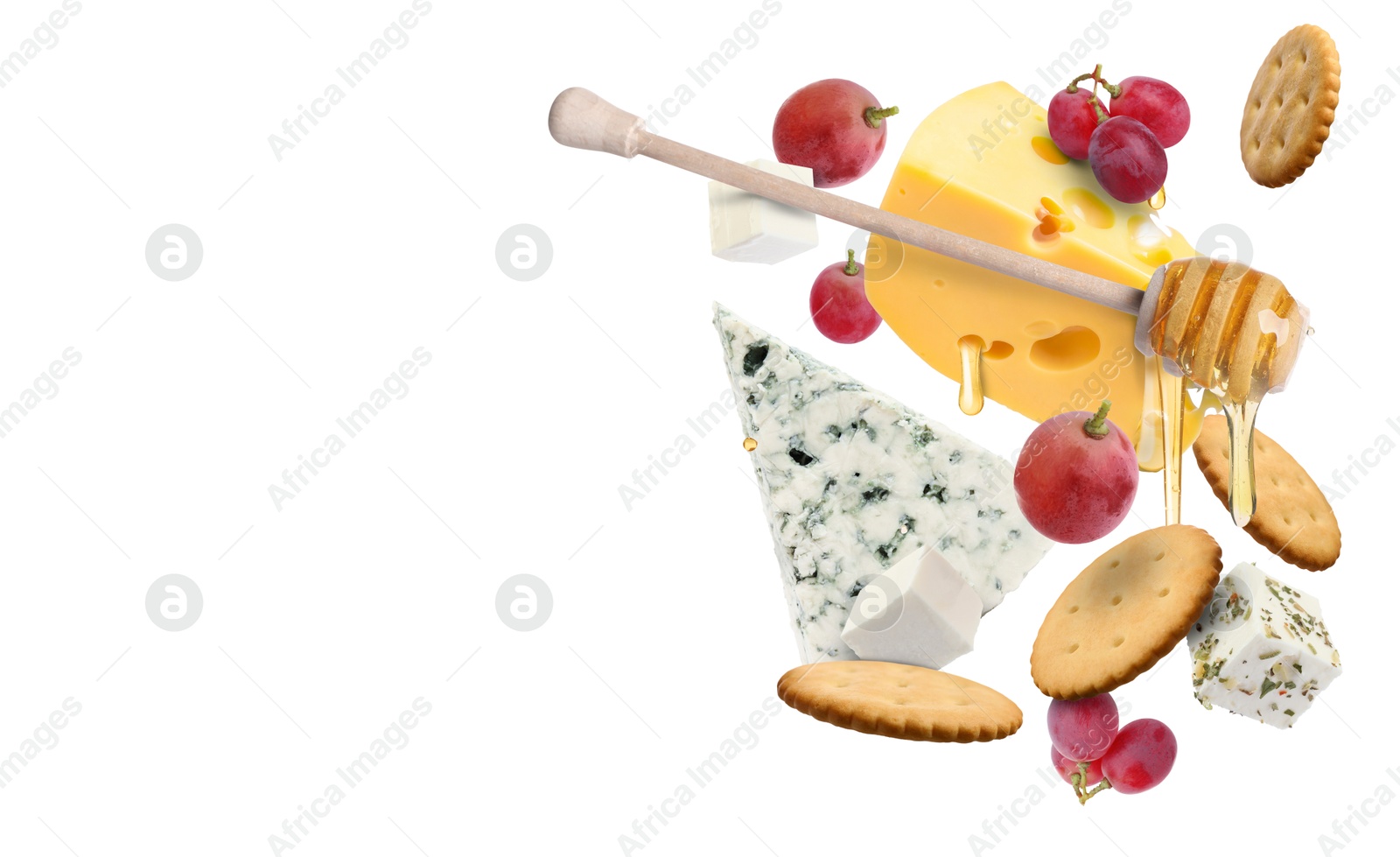 Cheese board products in air on white background. Different types of cheese, grapes, crackers and honey Image of Cheese board products in air on white background. Different types of cheese, grapes, crackers and honey