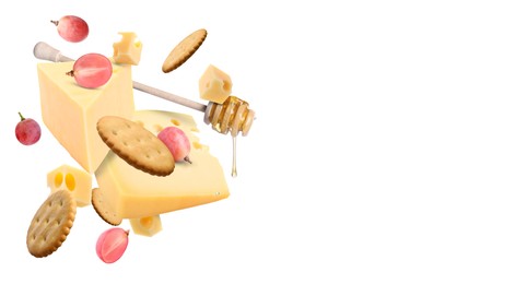 Image of Cheese board products in air on white background. Different types of cheese, grapes, crackers and honey