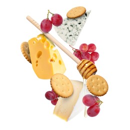 Image of Cheese board products in air on white background. Different types of cheese, grapes, crackers and honey