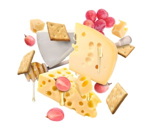 Image of Cheese board products in air on white background. Different types of cheese, grapes, crackers and honey