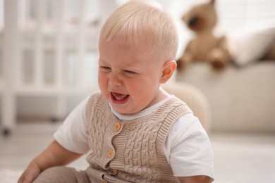 Photo of Portrait of newborn baby crying at home