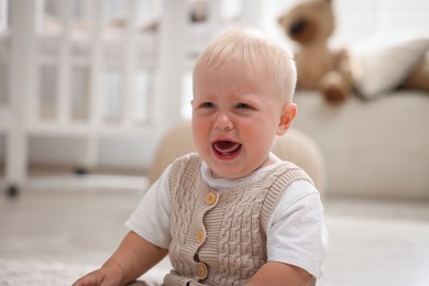Photo of Portrait of newborn baby crying at home