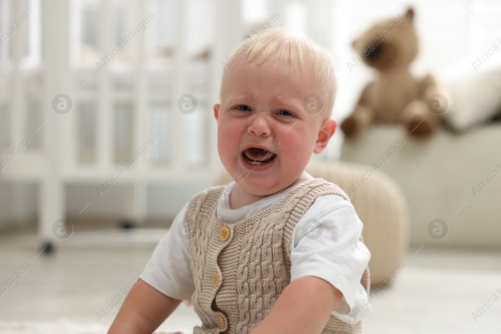 Photo of Portrait of newborn baby crying at home