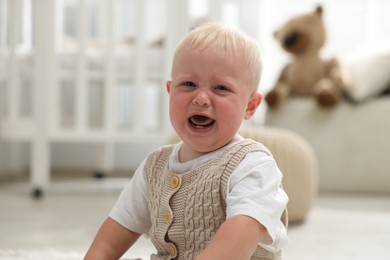 Photo of Portrait of newborn baby crying at home