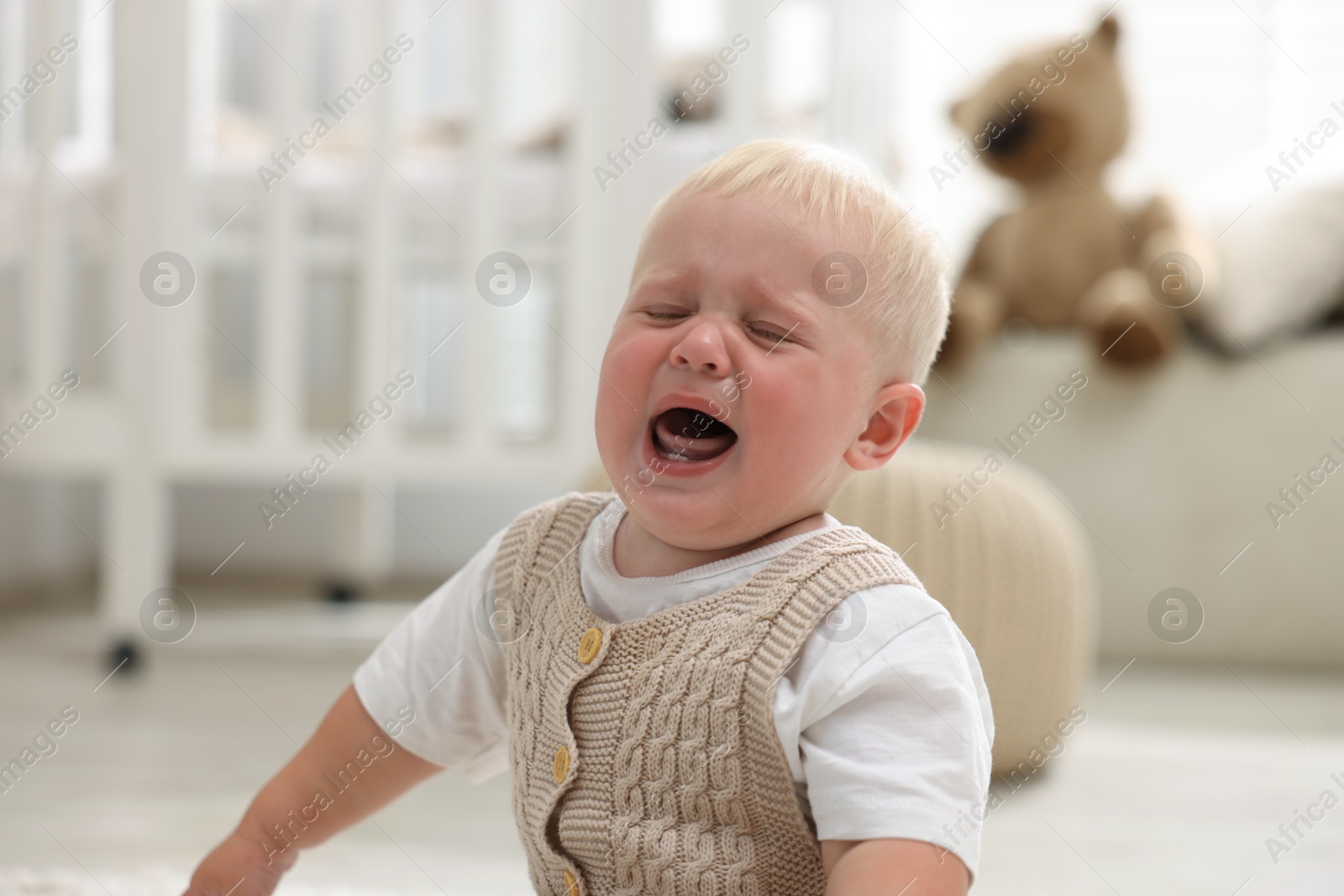 Photo of Portrait of newborn baby crying at home