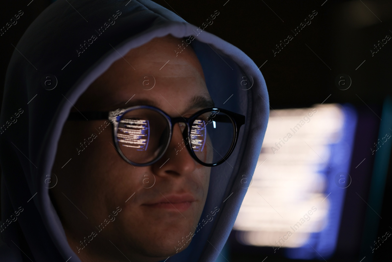 Young man wearing glasses with reflection on blurred background, closeup Photo of Young man wearing glasses with reflection on blurred background, closeup
