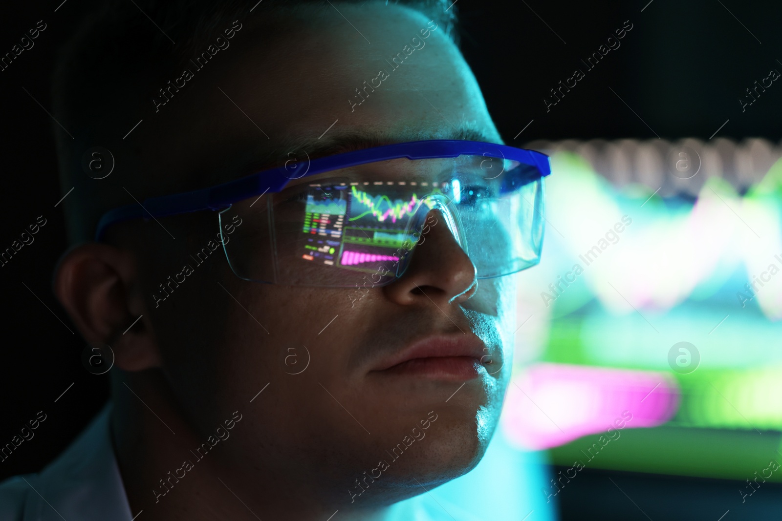 Young man wearing glasses with reflection on blurred background, closeup Photo of Young man wearing glasses with reflection on blurred background, closeup
