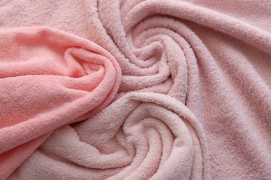 Photo of Soft pink towels as background, above view