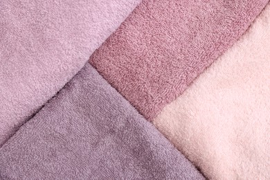 Photo of Soft pink towels as background, top view