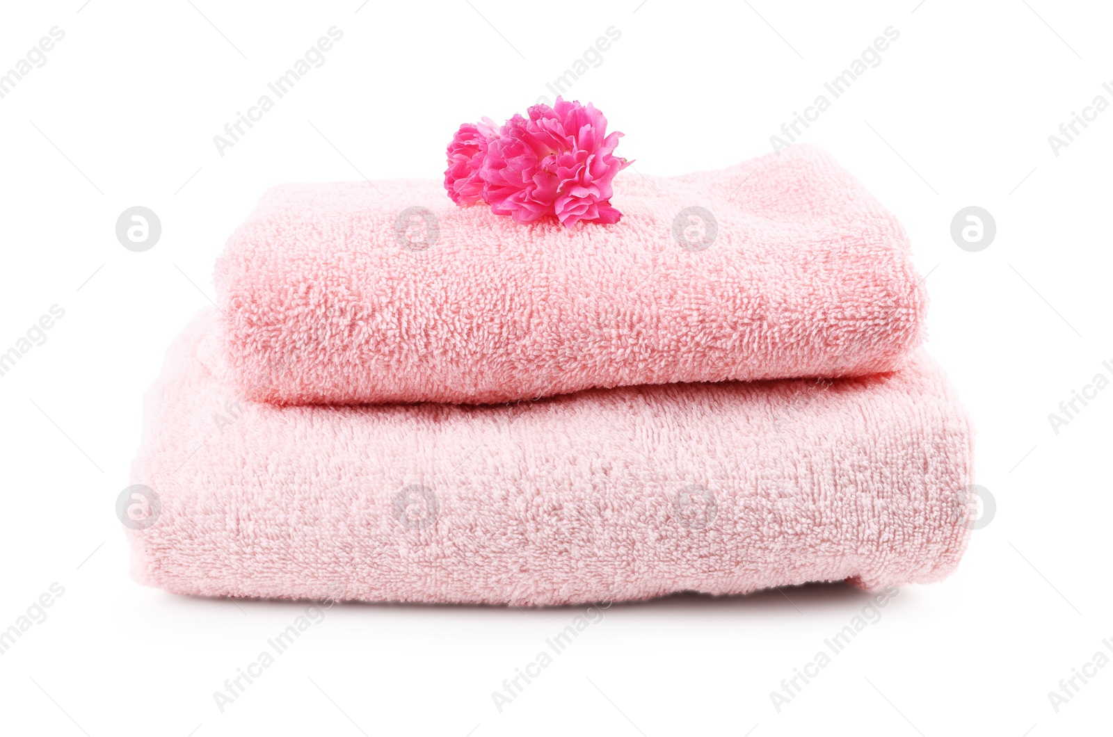 Photo of Soft towels and flower isolated on white