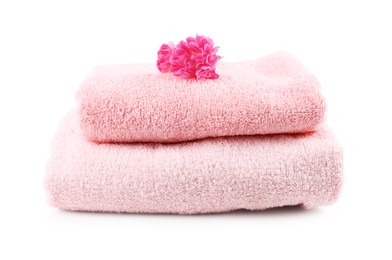Photo of Soft towels and flower isolated on white