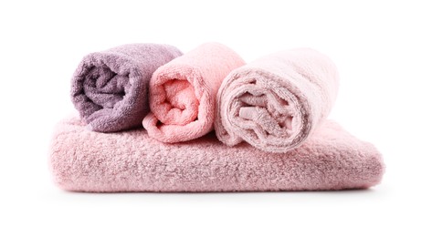 Photo of Rolled pink and purple towels isolated on white